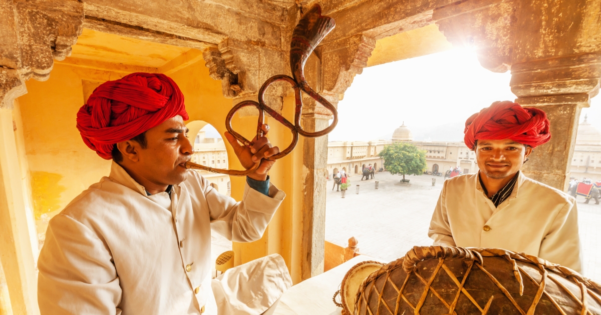 Indian musicians playing drums and traditional trumpet, in Amber Palace, Jaipur, India